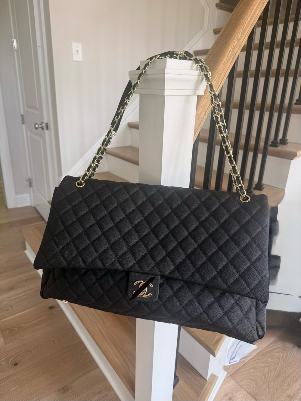 Black Quilted Shoulder Bag with Gold Chain design